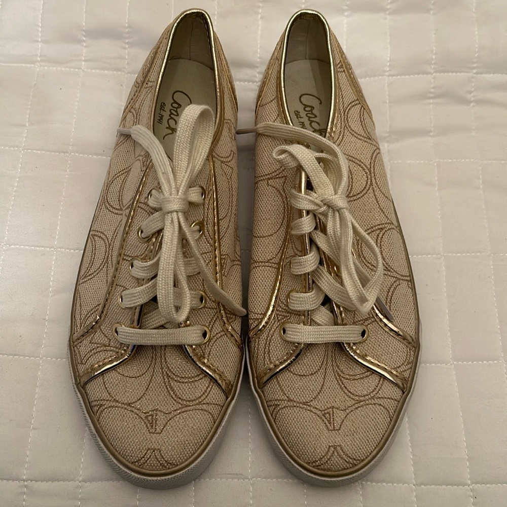 Coach sneakers. Size 7.5B. Cream with gold piping.